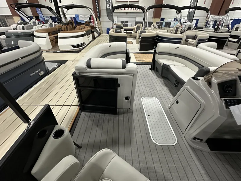 Slide: The Image of Luxurious 2024 Starcraft EXS 3 HB4TT pontoon boat interior with plush seating and modern design. - 14