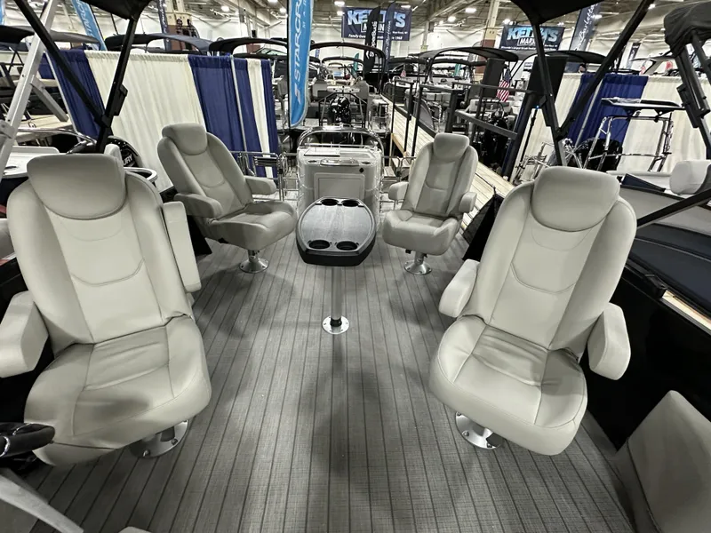 Slide: The Image of 2024 Starcraft EXS 3 HB4TT boat interior with four plush seats and a central table. - 9