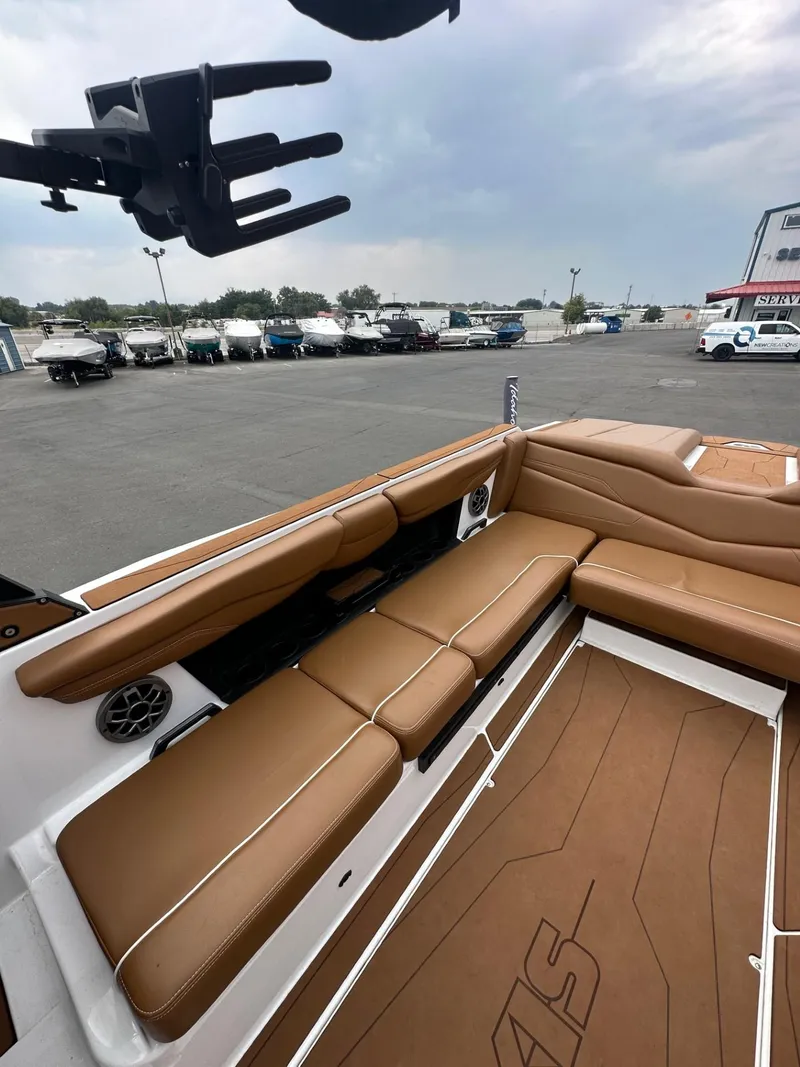 Slide: The Image of 2023 Axis T250 boat interior with tan seating and spacious deck. - 12