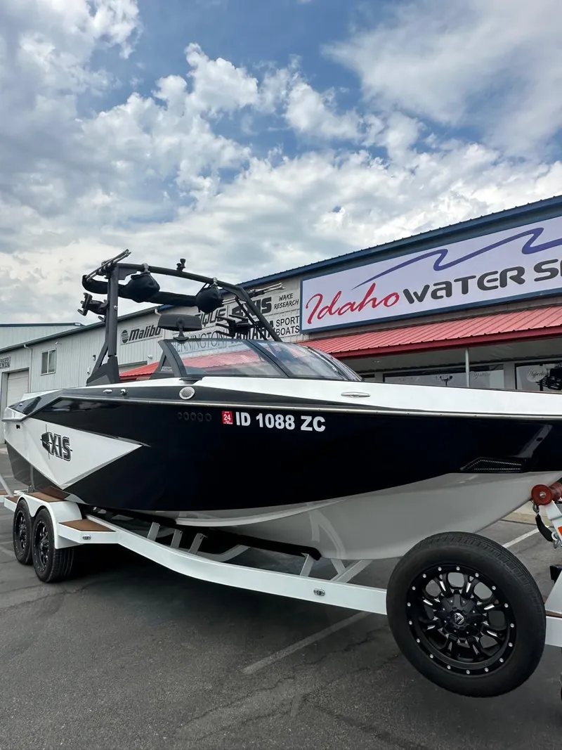 Slide: The Image of 2023 Axis T250 boat on trailer at Idaho Water Sports dealership. - 3
