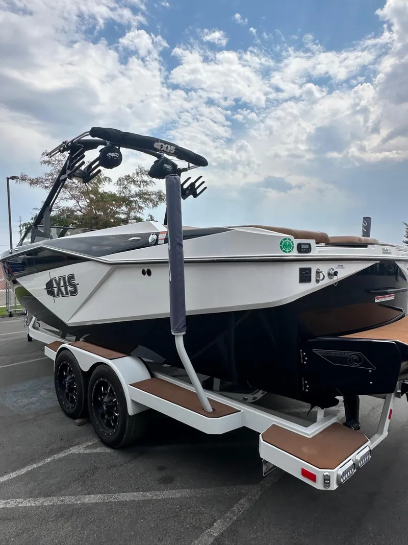 Slide: The Image of 2023 Axis T250 boat on trailer under cloudy sky. - 7