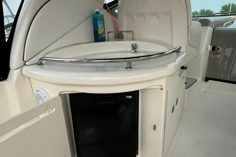Slide: The Image of 2007 Sea Ray 340 Sundancer boat interior with sink and mini fridge. - 11