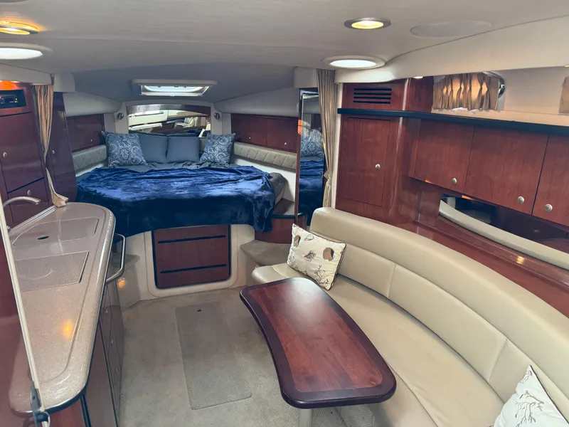 Slide: The Image of Luxurious interior of 2007 Sea Ray 340 Sundancer yacht with cozy seating and elegant wood finishes. - 13