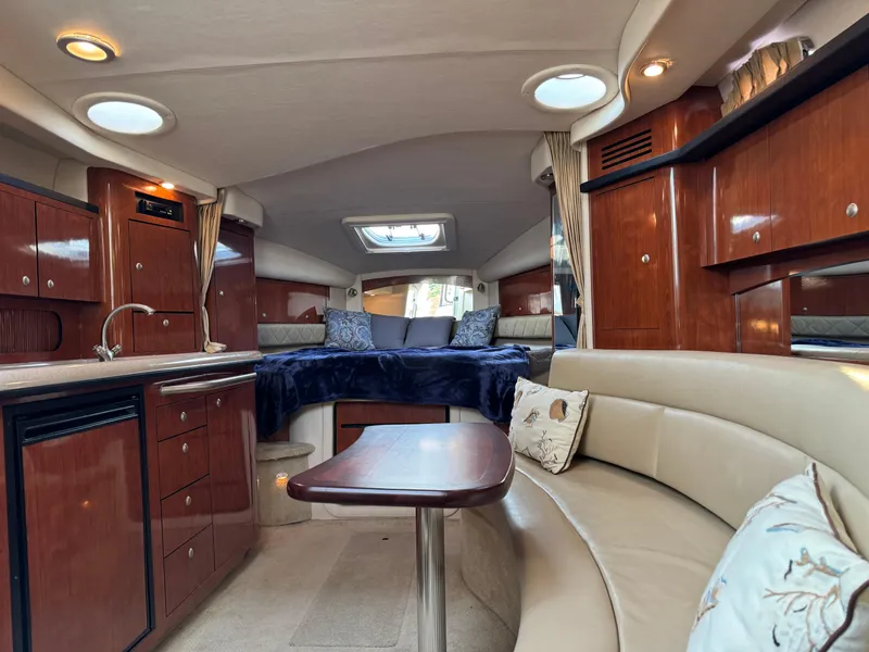 Slide: The Image of Luxurious interior of 2007 Sea Ray 340 Sundancer yacht with elegant wood finishes and cozy seating. - 23