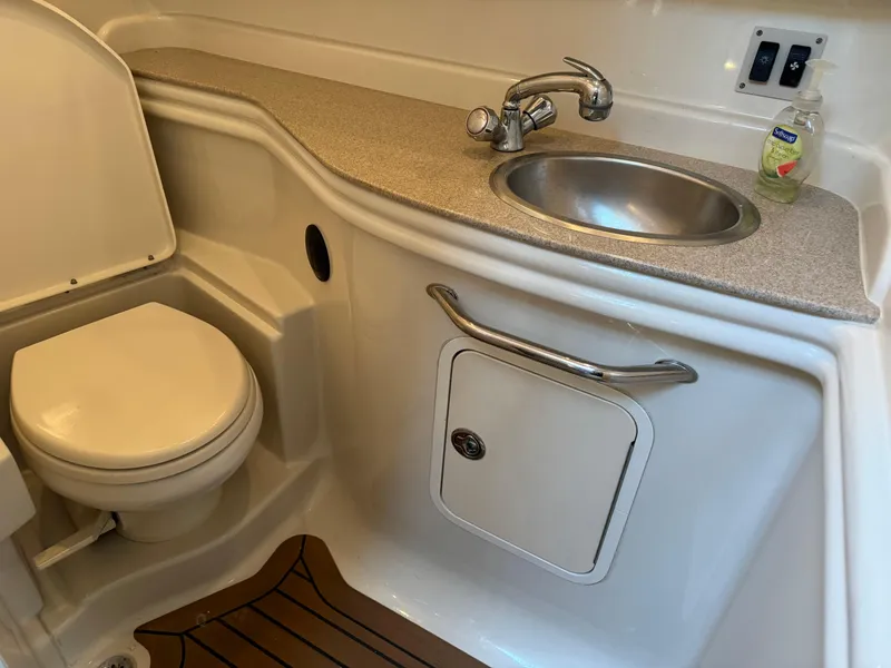 Slide: The Image of 2007 Sea Ray 340 Sundancer bathroom with sink, toilet, and countertop. - 25