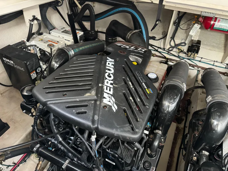 Slide: The Image of Engine compartment of a 2007 Sea Ray 340 Sundancer with Mercury engine components. - 26