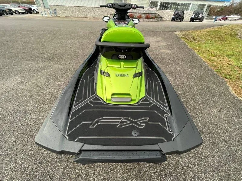 Slide: The Image of 2024 Yamaha Waverunner FX Cruiser SVHO, green, rear view, on pavement. - 10