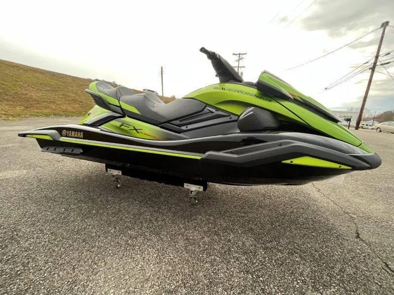 Slide: The Image of 2024 Yamaha Waverunner FX Cruiser SVHO in green, featuring an advanced audio system. - 11