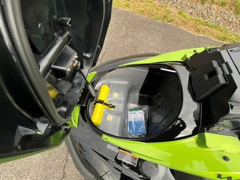 Slide: The Image of 2024 Yamaha Waverunner FX Cruiser SVHO storage compartment open, showing interior details. - 12