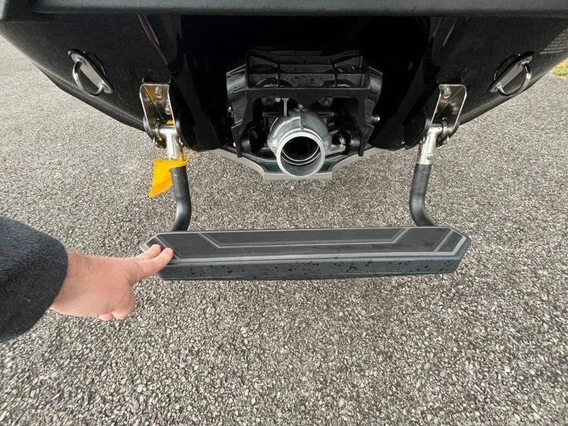 Slide: The Image of 2024 Yamaha Waverunner FX Cruiser SVHO rear view with retractable step on asphalt. - 21