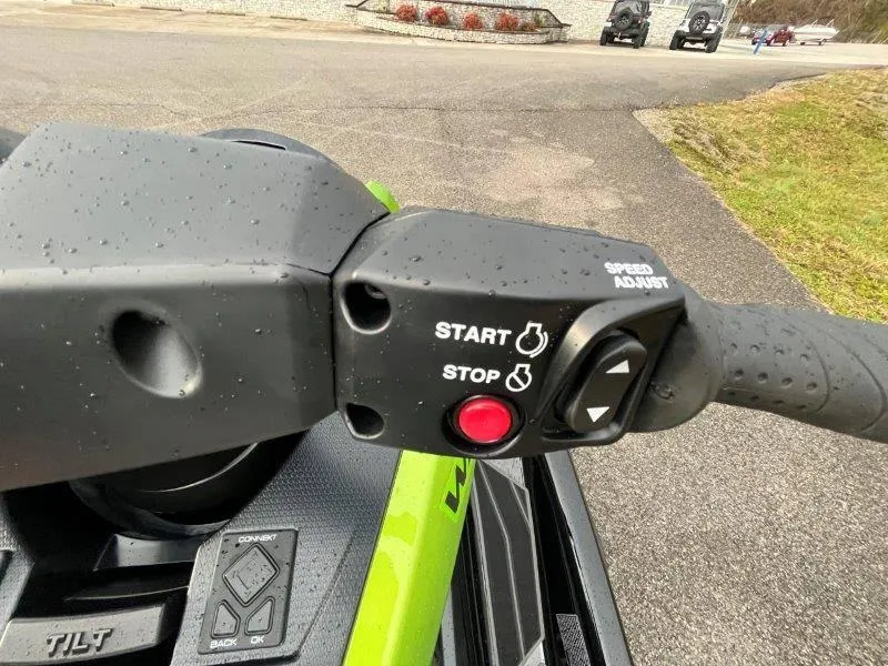 Slide: The Image of Close-up of 2024 Yamaha Waverunner FX Cruiser SVHO handlebar controls with start and stop buttons. - 23