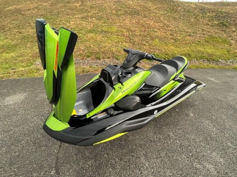 Slide: The Image of 2024 Yamaha Waverunner FX Cruiser SVHO with Audio System, lime green and black, on pavement. - 31
