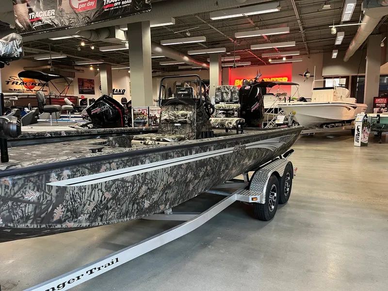 Slide: The Image of 2024 Ranger RB210 boat with camouflage design on display in showroom. - 3