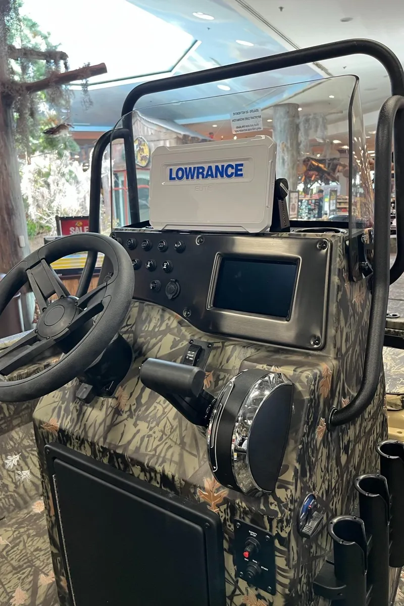 Slide: The Image of 2024 Ranger RB210 boat console with Lowrance navigation system in a showroom. - 7
