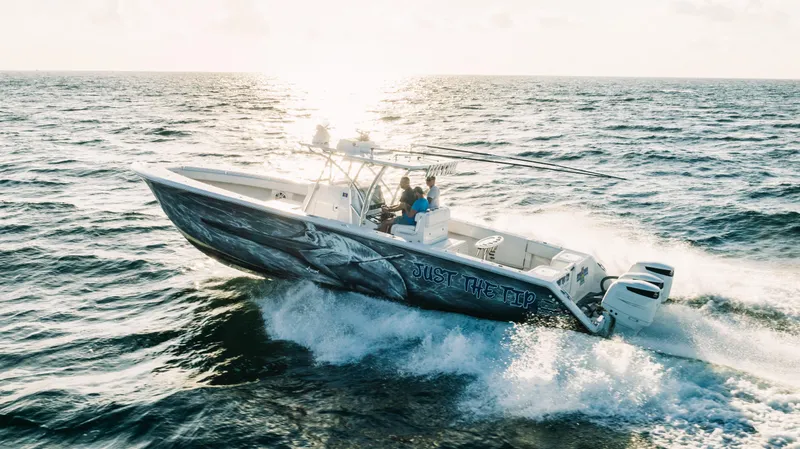 Slide: The Image of 2018 SeaHunter 39 Tournament boat cruising on open ocean waters. - 17