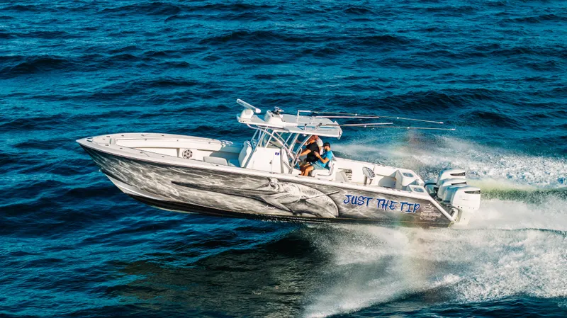 Slide: The Image of 2018 SeaHunter 39 Tournament boat speeding on ocean waters. - 21