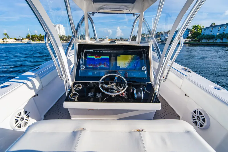 Slide: The Image of 2018 SeaHunter 39 Tournament boat cockpit with advanced navigation system on open water. - 35