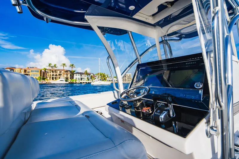 Slide: The Image of Interior view of 2018 SeaHunter 39 Tournament boat with luxurious seating and control panel. - 44
