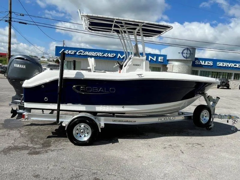 Slide: The Image of 2024 Robalo R180 boat on trailer at Lake Cumberland Marine dealership. - 25