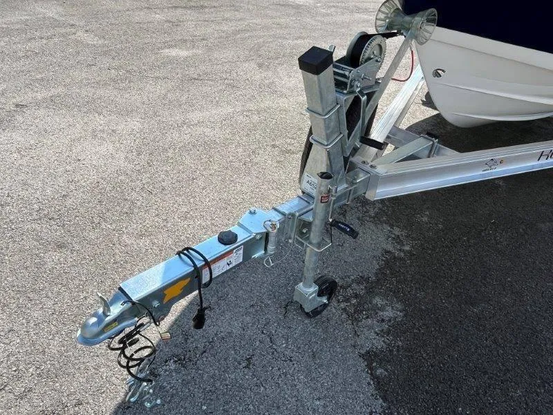 Slide: The Image of Trailer hitch of 2024 Robalo R180 boat on asphalt surface. - 30
