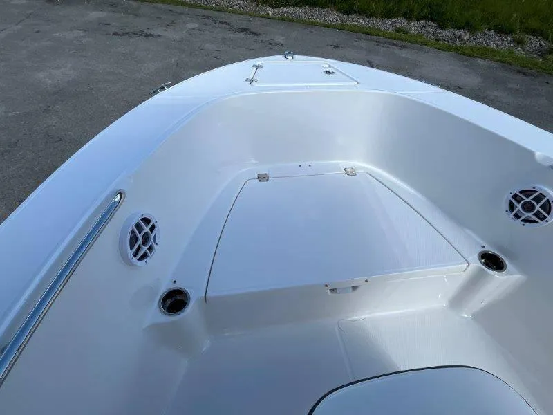 Slide: The Image of 2024 Robalo R180 boat interior with storage compartment and speakers. - 32
