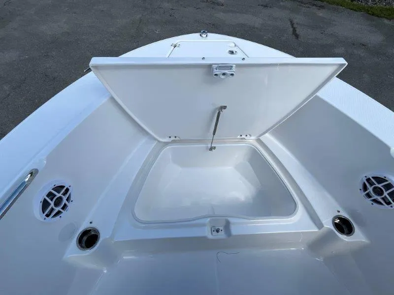 Slide: The Image of 2024 Robalo R180 boat storage compartment with open hatch, showcasing interior space. - 43