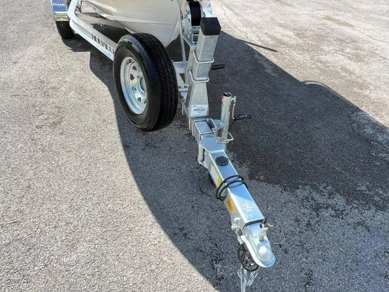 Slide: The Image of 2024 Robalo R180 boat trailer hitch on asphalt surface. - 44