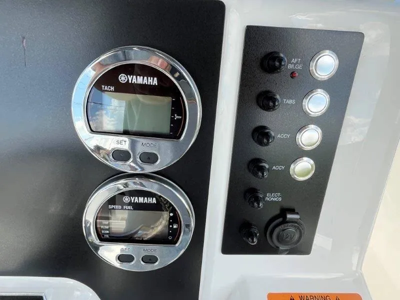 Slide: The Image of 2024 Robalo R180 dashboard with Yamaha gauges and control panel. - 45