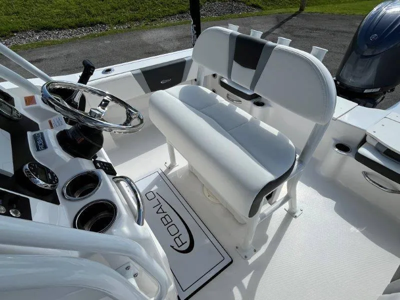 Slide: The Image of 2024 Robalo R180 boat interior with steering wheel and seating. - 46