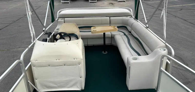 Slide: The Image of 2001 Sea Hunt 20 boat interior with white seating and steering console. - 10