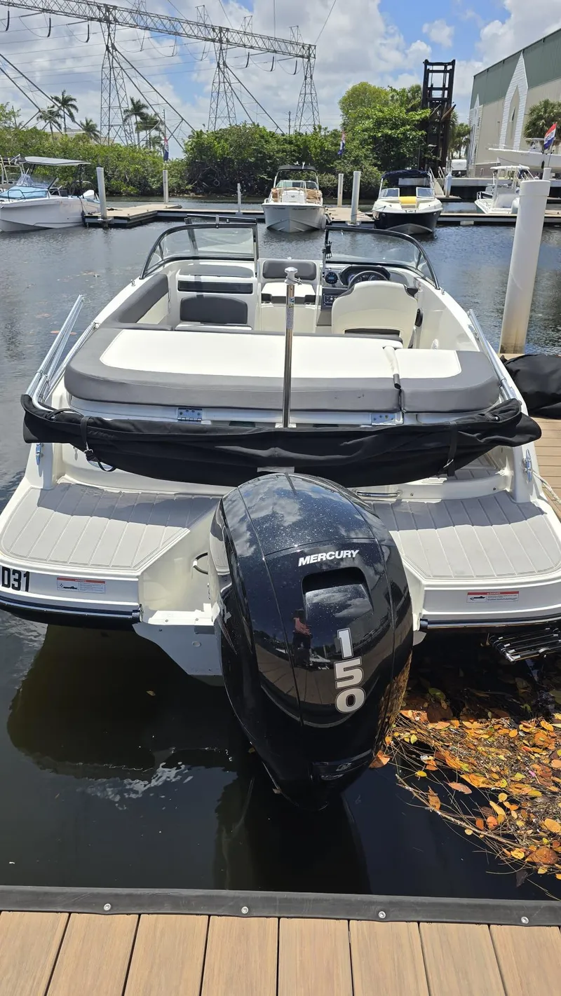 Slide: The Image of 2021 Bayliner VR5 Bowrider OB with Mercury 150 engine docked at marina. - 6