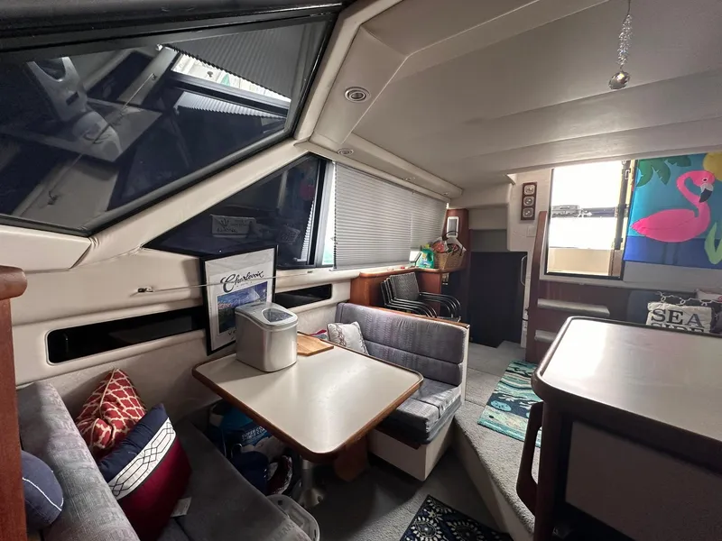 Slide: The Image of Interior of 1993 Carver 33 Aft Cabin with cozy seating and nautical decor. - 17