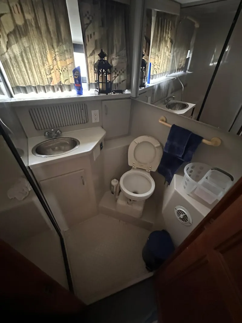 Slide: The Image of Bathroom interior of 1993 Carver 33 Aft Cabin yacht with sink and toilet. - 22