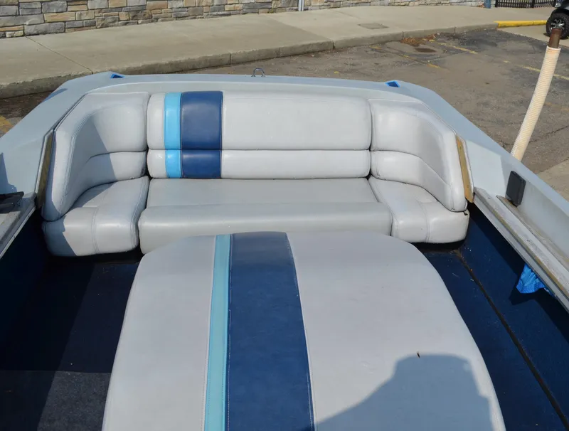 Slide: The Image of 1989 Correct Craft Ski Nautique boat interior with blue and gray seating. - 7