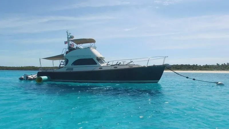 Slide: The Image of Hinckley Talaria 44 FB yacht anchored in clear blue water, 2002 model. - 0