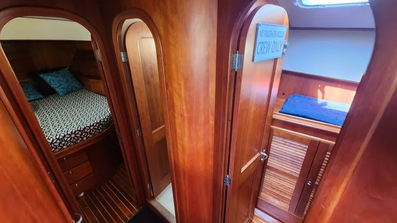 Slide: The Image of Interior of 2002 Hinckley Talaria 44 FB yacht with wood finish and cozy cabin. - 12