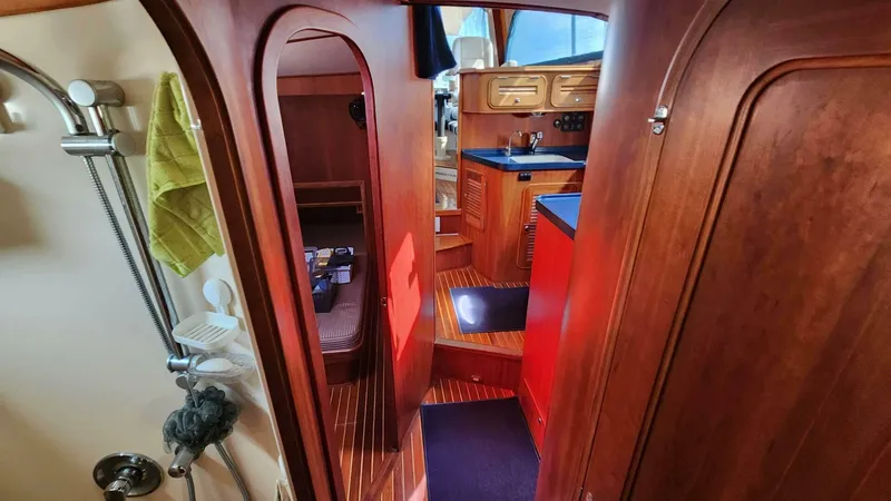 Slide: The Image of Interior of 2002 Hinckley Talaria 44 FB yacht with wood finish and compact layout. - 18