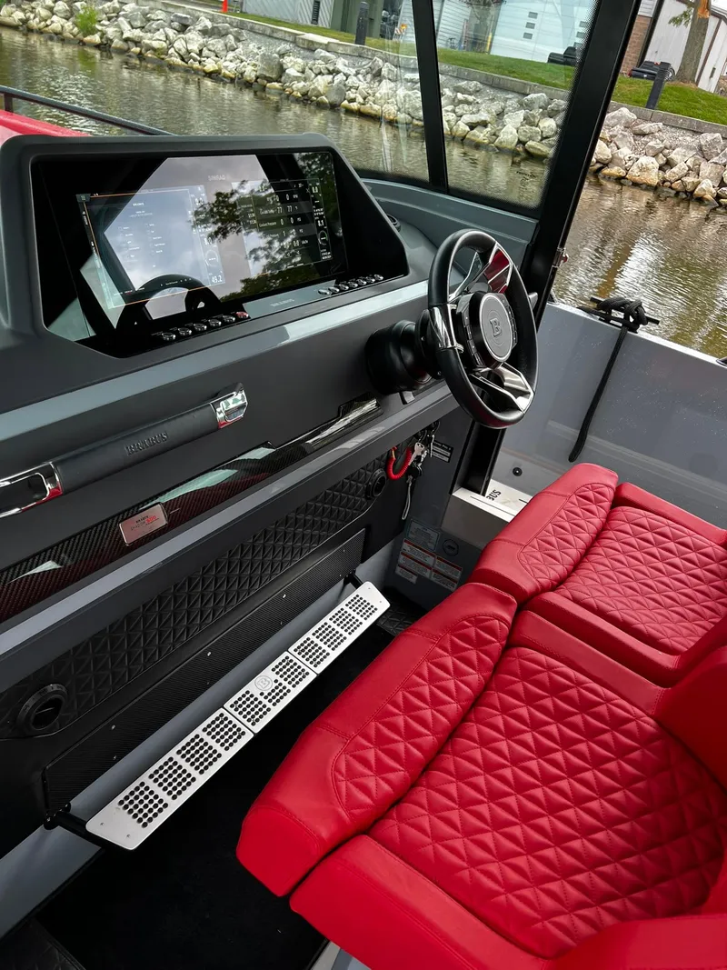Slide: The Image of 2022 BRABUS Shadow 500 Cabin interior with red quilted seats and modern dashboard. - 33