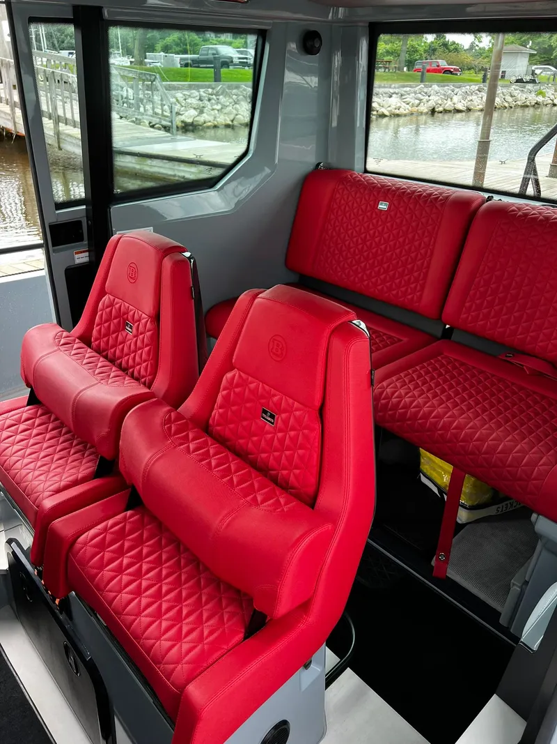Slide: The Image of 2022 BRABUS Shadow 500 Cabin interior with luxurious red quilted seats. - 38