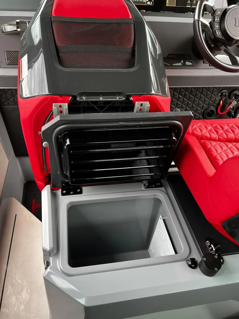 Slide: The Image of 2022 BRABUS Shadow 500 Cabin interior with open storage compartment and red seating. - 39