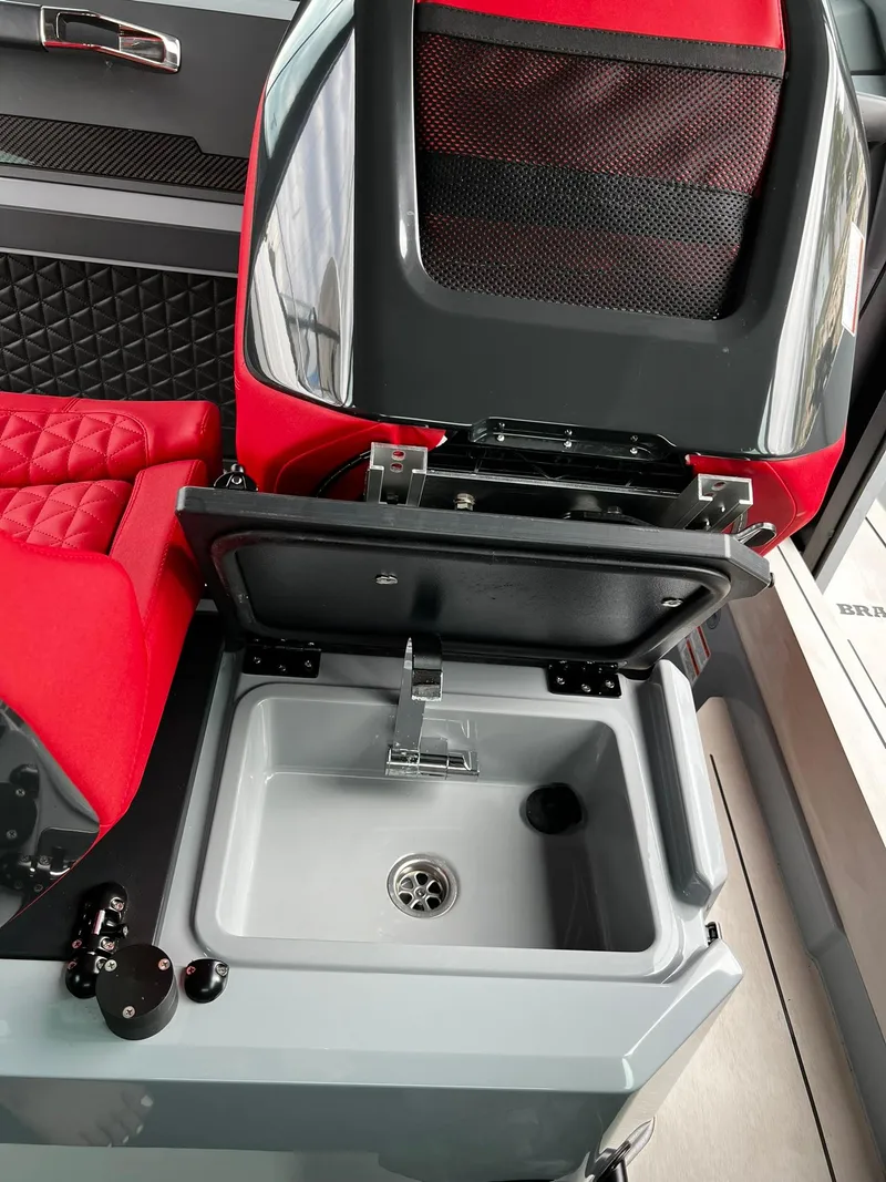 Slide: The Image of 2022 BRABUS Shadow 500 Cabin interior with red seating and compact sink. - 41