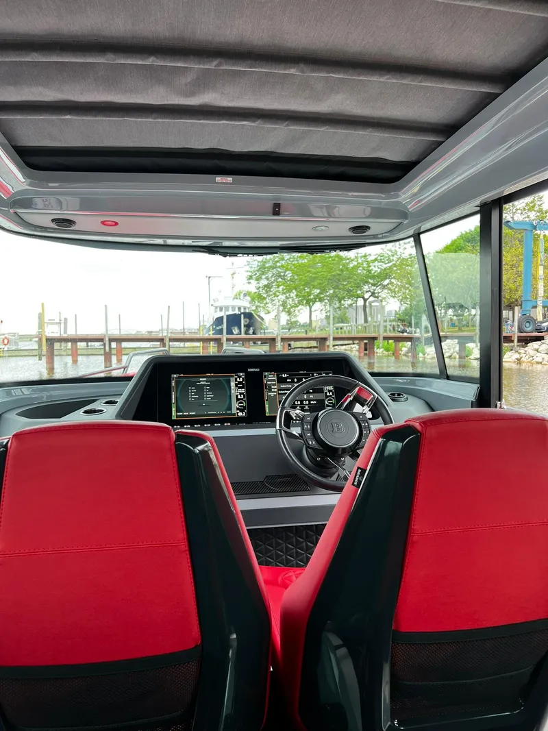 Slide: The Image of Interior of 2022 BRABUS Shadow 500 Cabin with red seats and modern dashboard. - 42