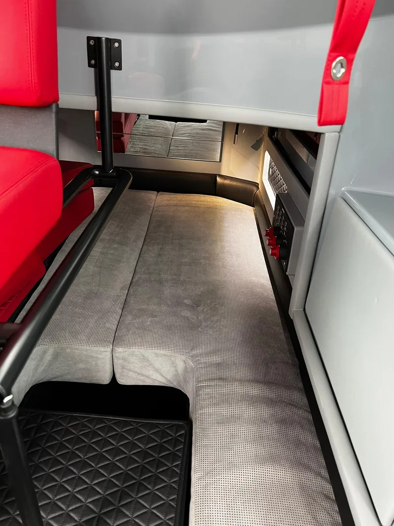 Slide: The Image of Interior of 2022 BRABUS Shadow 500 Cabin with red seating and modern design. - 45