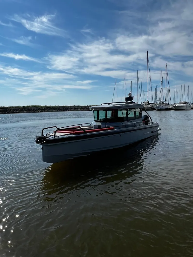 Slide: The Image of 2022 BRABUS Shadow 500 Cabin boat on calm water under a blue sky. - 8