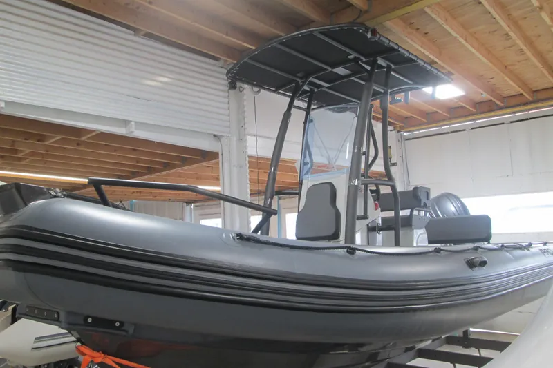 The Image of 2025 Zodiac Pro 6.5 inflatable boat in a showroom, featuring a sleek design and sturdy build. - 0