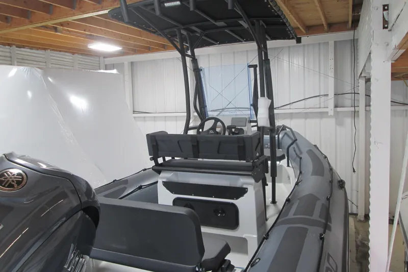 Slide: The Image of 2025 Zodiac Pro 6.5 boat in storage, featuring a sleek design and modern equipment. - 3