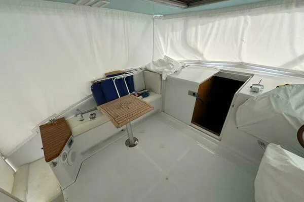 Slide: The Image of 2002 Luhrs 38 Open boat interior with seating and table. - 10