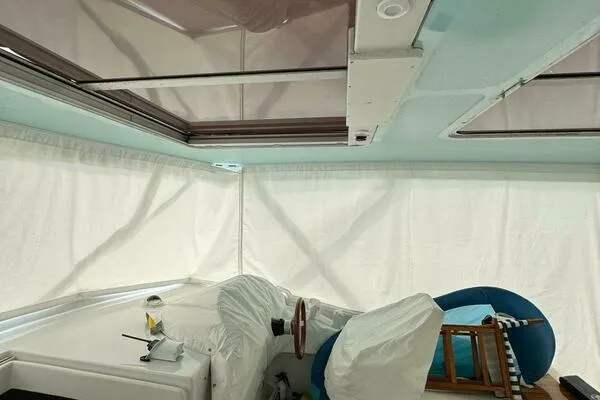 Slide: The Image of Interior view of a 2002 Luhrs 38 Open boat with covered seating and helm. - 11