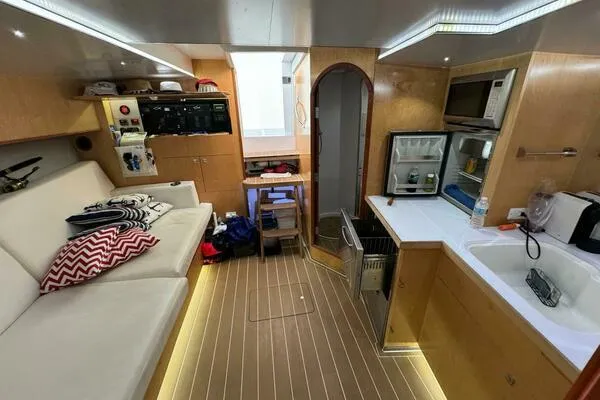 Slide: The Image of Interior of 2002 Luhrs 38 Open yacht with kitchenette and seating area. - 15