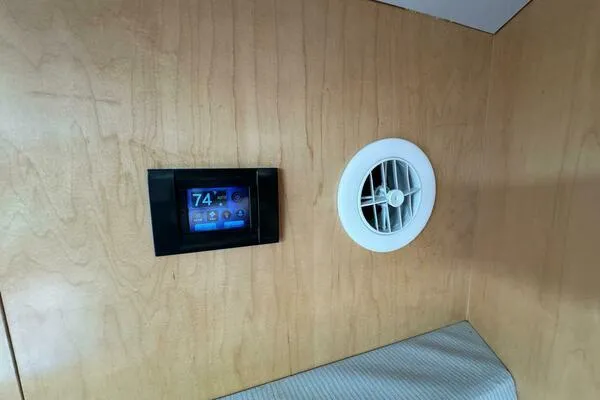 Slide: The Image of Wall-mounted control panel and vent in 2002 Luhrs 38 Open boat interior. - 21